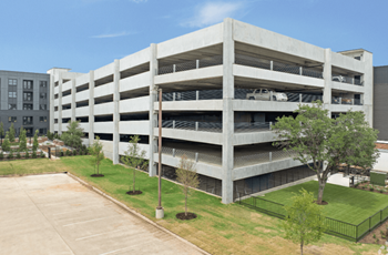 A parking garage with multiple levels and cars parked inside.
